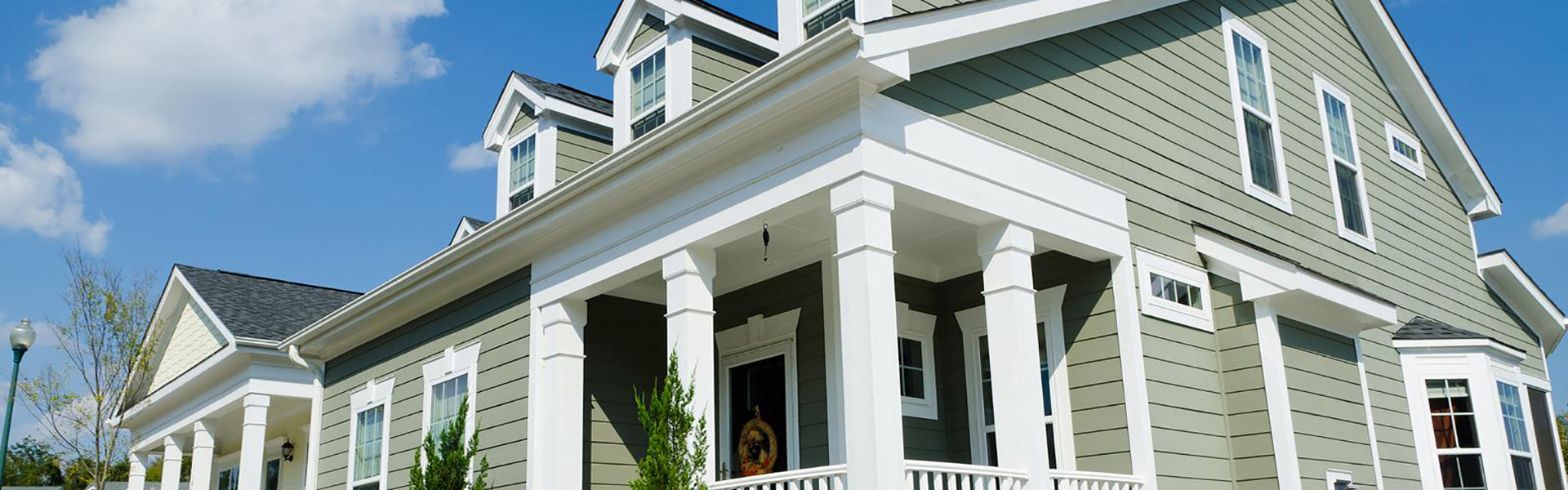 Mid-class home with light green siding